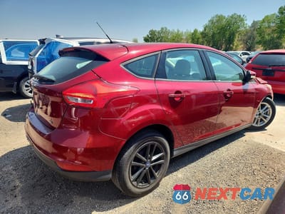 Trzecie zdjęcie samochodu z tyłu: 2017 FORD FOCUS SE VIN:1FADP3K2XHL205614 - miniatura