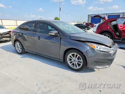 Czwarte zdjęcie samochodu z boku: 2017 FORD FOCUS SE VIN:1FADP3F27HL342231 - miniatura