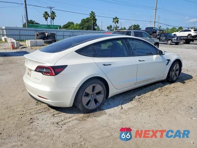 Trzecie zdjęcie samochodu z tyłu: 2021 TESLA MODEL 3 VIN:5YJ3E1EB6MF992702 - miniatura