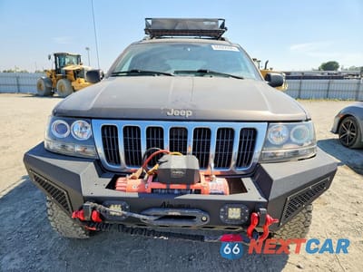 Piąte zdjęcie samochodu w środku: 1999 JEEP GRAND CHEROKEE LAREDO VIN:1J4GW58S5XC687799 - miniatura