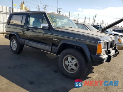 Czwarte zdjęcie samochodu z boku: 1990 JEEP CHEROKEE LAREDO VIN:1J4FJ57L0LL286627 - miniatura