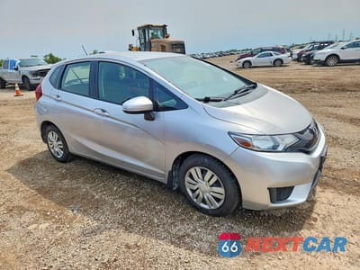Czwarte zdjęcie samochodu z boku: 2015 HONDA FIT LX VIN:3HGGK5H54FM738588 - miniatura