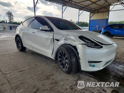 Czwarte zdjęcie samochodu z boku: 2022 TESLA MODEL Y VIN:7SAYGDEE3NF408630 - miniatura