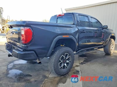 Trzecie zdjęcie samochodu z tyłu: 2024 GMC CANYON AT4X VIN:1GTP6EEK5R1148978 - miniatura