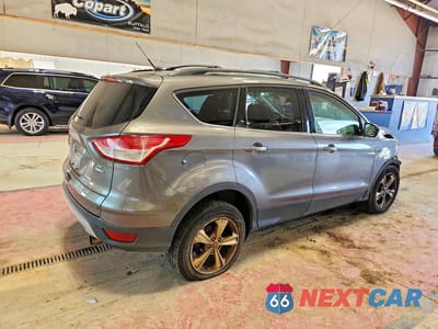 Trzecie zdjęcie samochodu z tyłu: 2013 FORD ESCAPE SE VIN:1FMCU9G93DUD14150 - miniatura