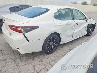 Trzecie zdjęcie samochodu z tyłu: 2023 TOYOTA CAMRY HYBRID SE VIN:4T1G31AK8PU609766 - miniatura
