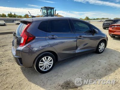 Trzecie zdjęcie samochodu z tyłu: 2017 HONDA FIT LX VIN:3HGGK5H54HM714097 - miniatura