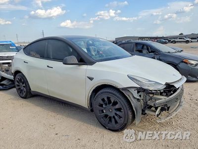 Czwarte zdjęcie samochodu z boku: 2023 TESLA MODEL Y VIN:7SAYGDEE6PA057180 - miniatura