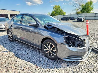 Czwarte zdjęcie samochodu z boku: 2017 VOLKSWAGEN JETTA SE VIN:3VWB67AJ7HM300325 - miniatura