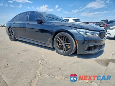 Czwarte zdjęcie samochodu z boku: 2019 BMW 750 XI VIN:WBA7F2C51KB239416 - miniatura