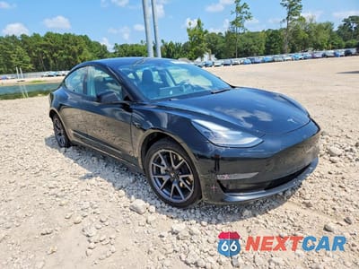 Czwarte zdjęcie samochodu z boku: 2022 TESLA MODEL 3 VIN:5YJ3E1EA2NF370218 - miniatura