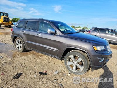 Czwarte zdjęcie samochodu z boku: 2014 JEEP GRAND CHEROKEE OVERLAND VIN:1C4RJFCMXEC572883 - miniatura