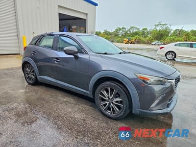 Czwarte zdjęcie samochodu z boku: 2017 MAZDA CX-3 TOURING VIN:JM1DKDC72H0159139 - miniatura