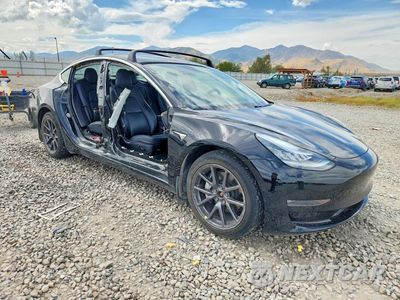 Czwarte zdjęcie samochodu z boku: 2019 TESLA MODEL 3 VIN:5YJ3E1EB4KF451760 - miniatura