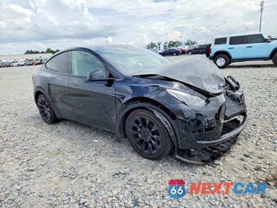 Czwarte zdjęcie samochodu z boku: 2023 TESLA MODEL Y VIN:7SAYGAEE9PF767014 - miniatura