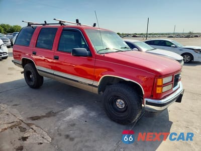 Czwarte zdjęcie samochodu z boku: 1999 GMC YUKON VIN:1GKEC13R8XJ732463 - miniatura