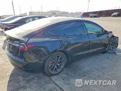 Trzecie zdjęcie samochodu z tyłu: 2021 TESLA MODEL 3 VIN:5YJ3E1EA0MF986787 - miniatura