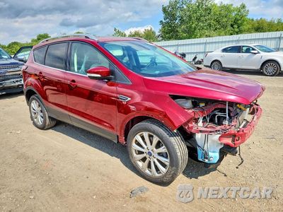 Czwarte zdjęcie samochodu z boku: 2017 FORD ESCAPE TITANIUM VIN:1FMCU9J93HUD48071 - miniatura
