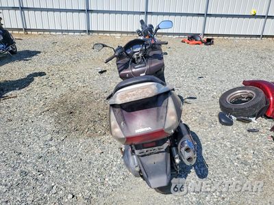 Czwarte zdjęcie samochodu z boku: 2004 HONDA FSC600 D VIN:JH2PF01184K200663 - miniatura