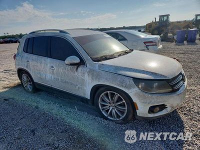 Czwarte zdjęcie samochodu z boku: 2014 VOLKSWAGEN TIGUAN S VIN:WVGAV3AX4EW624029 - miniatura