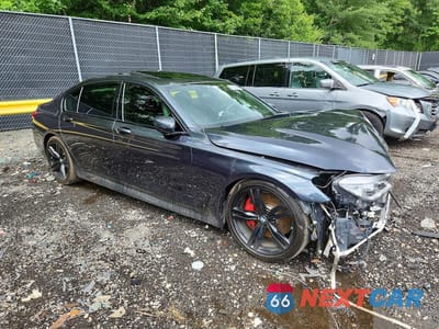 Czwarte zdjęcie samochodu z boku: 2018 BMW 750 I VIN:WBA7F0C59JGM22648 - miniatura