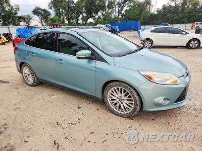 Czwarte zdjęcie samochodu z boku: 2012 FORD FOCUS SEL VIN:1FAHP3H29CL232031 - miniatura