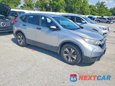 Czwarte zdjęcie samochodu z boku: 2017 HONDA CR-V LX VIN:7FARW5H31HE012144 - miniatura