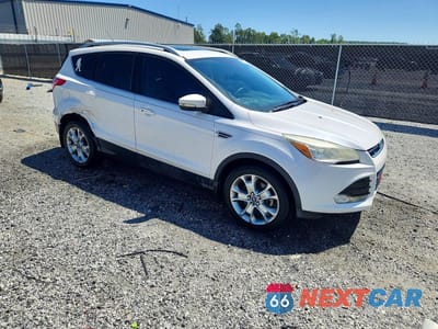 Czwarte zdjęcie samochodu z boku: 2014 FORD ESCAPE TITANIUM VIN:1FMCU0J94EUE20287 - miniatura