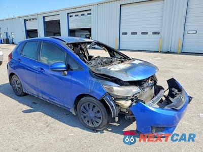 Czwarte zdjęcie samochodu z boku: 2015 HONDA FIT LX VIN:3HGGK5H50FM714160 - miniatura