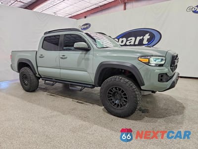 Czwarte zdjęcie samochodu z boku: 2021 TOYOTA TACOMA TRD PRO VIN:5TFCZ5AN4MX245083 - miniatura