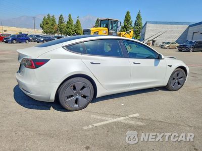 Trzecie zdjęcie samochodu z tyłu: 2022 TESLA MODEL 3 VIN:5YJ3E1EB2NF168567 - miniatura