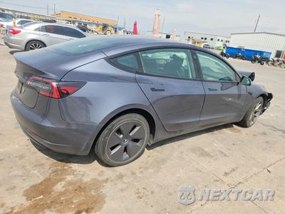 Trzecie zdjęcie samochodu z tyłu: 2023 TESLA MODEL 3 VIN:5YJ3E1EA0PF595403 - miniatura