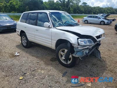 Czwarte zdjęcie samochodu z boku: 1999 TOYOTA RAV4 BASE VIN:JT3GP10V1X7064629 - miniatura