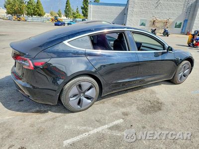 Trzecie zdjęcie samochodu z tyłu: 2019 TESLA MODEL 3 VIN:5YJ3E1EA0KF297233 - miniatura