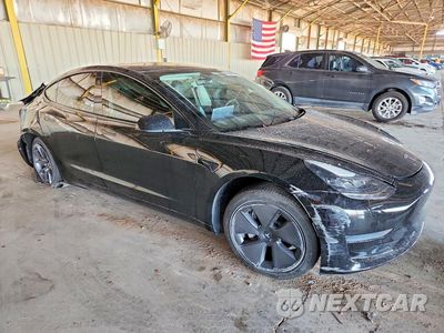Czwarte zdjęcie samochodu z boku: 2021 TESLA MODEL 3 VIN:5YJ3E1EAXMF867872 - miniatura