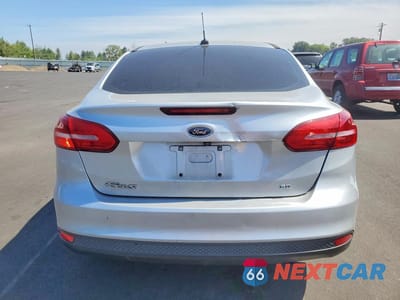 Zdjęcie 6 z 12 samochodu: 2018 FORD FOCUS SE VIN:1FADP3F27JL237470 - miniatura