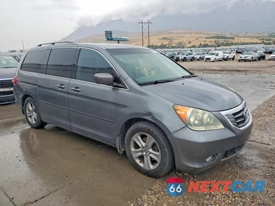 Czwarte zdjęcie samochodu z boku: 2010 HONDA ODYSSEY TOURING VIN:5FNRL3H95AB018905 - miniatura