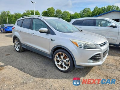 Czwarte zdjęcie samochodu z boku: 2016 FORD ESCAPE TITANIUM VIN:1FMCU9J98GUB90633 - miniatura