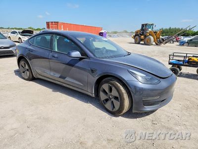 Czwarte zdjęcie samochodu z boku: 2023 TESLA MODEL 3 VIN:5YJ3E1EA0PF557007 - miniatura