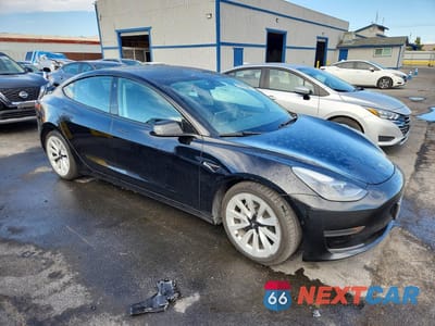 Czwarte zdjęcie samochodu z boku: 2022 TESLA MODEL 3 VIN:5YJ3E1EA8NF285674 - miniatura