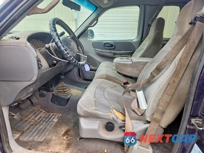 Zdjęcie 7 z 12 samochodu: 2000 FORD F150 VIN:1FTRX18L2YNA44491 - miniatura