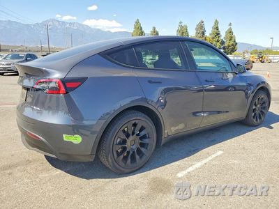 Trzecie zdjęcie samochodu z tyłu: 2022 TESLA MODEL Y VIN:7SAYGAEE6NF574137 - miniatura