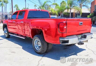 Czwarte zdjęcie samochodu z boku: 2016 GMC SIERRA K3500 SLT VIN:1GT42XE82GF226308 - miniatura