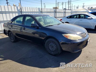 Czwarte zdjęcie samochodu z boku: 2002 TOYOTA CAMRY LE VIN:JTDBE32K320056835 - miniatura