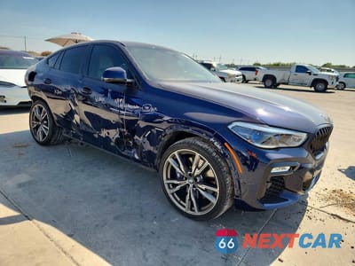 Czwarte zdjęcie samochodu z boku: 2021 BMW X6 M50I VIN:5UXCY8C03M9D78381 - miniatura