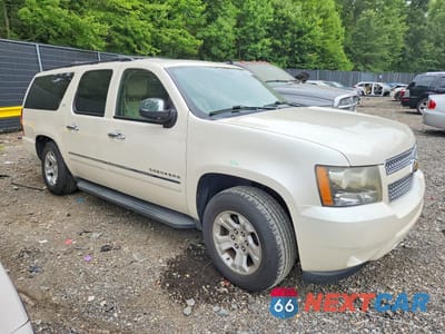 Czwarte zdjęcie samochodu z boku: 2011 CHEVROLET SUBURBAN K1500 LTZ VIN:1GNSKKE34BR366132 - miniatura