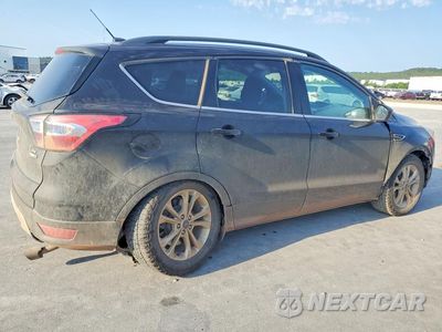 Trzecie zdjęcie samochodu z tyłu: 2018 FORD ESCAPE SE VIN:1FMCU9GD8JUC86488 - miniatura