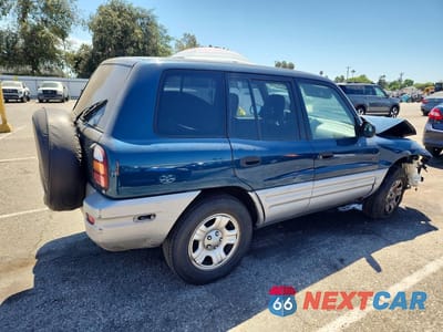 Trzecie zdjęcie samochodu z tyłu: 2000 TOYOTA RAV4 BASE VIN:JT3GP10V2Y7069971 - miniatura
