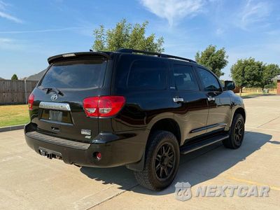 Czwarte zdjęcie samochodu z boku: 2014 TOYOTA SEQUOIA LIMITED VIN:5TDJW5G10ES104118 - miniatura