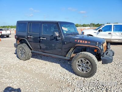 Czwarte zdjęcie samochodu z boku: 2014 JEEP WRANGLER UNLIMITED RUBICON VIN:1C4BJWFG8EL322288 - miniatura